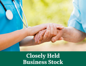 Two people holding hands. Closely Held Business Stock Rollover